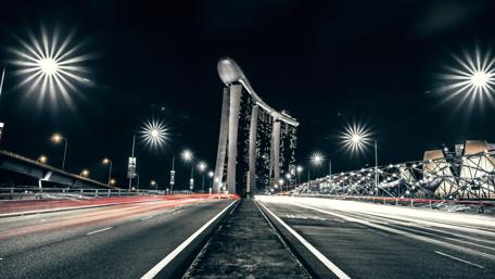 Night Drive Through Singapore's Illuminated Boulevards wallpaper
