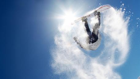 Thrilling Snowboard Aerial in Winter Landscape wallpaper