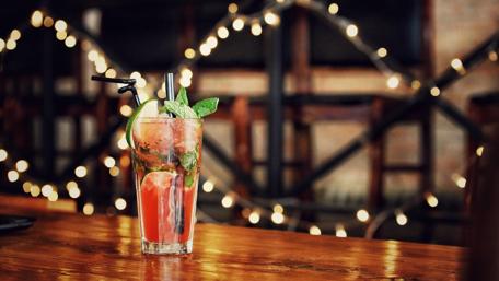 Refreshing Cocktail on a Wooden Table in 4K Quality wallpaper