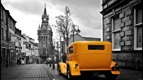 Yellow Car in a Monochromatic Cityscape wallpaper