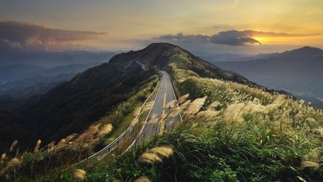 Pathway Through Majestic Mountain Scenery wallpaper