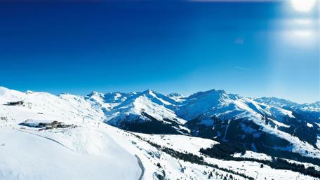 Majestic Winter Peaks Under Clear Blue Sky wallpaper
