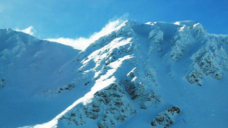 Majestic Snow-Capped Mountain Peaks Rising High wallpaper