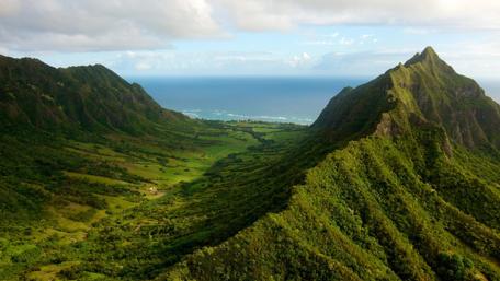Majestic Peaks and Ocean Horizon wallpaper