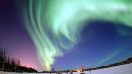 Majestic Aurora Borealis Illuminating the Night Sky wallpaper