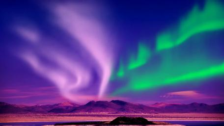 Dancing Auroras Over Majestic Mountains wallpaper