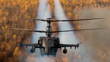 Helicopter Dominance Over Autumn Forest wallpaper