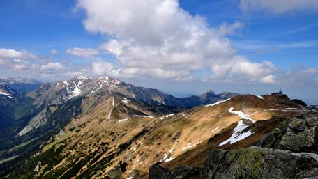 Majestic Mountain Landscape Under Blue Sky Clouds wallpaper