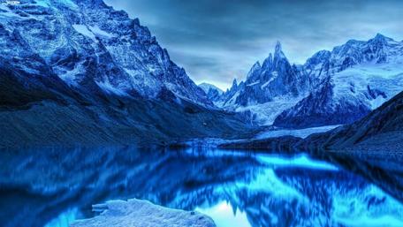 Majestic Snowy Mountains over Tranquil Blue Lake wallpaper