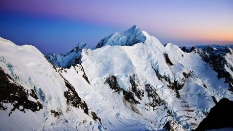 Majestic Snow-Capped Mountain Peak Scene wallpaper