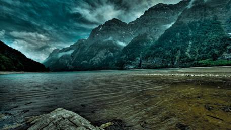 Mysterious Mountains Under Stormy Skies wallpaper