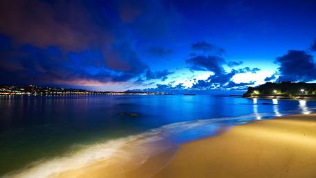 Serene Evening by the Shoreline with Deep Blue Skies wallpaper