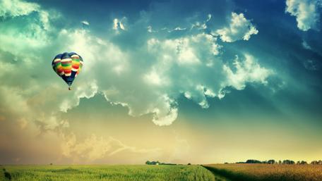 Colorful Hot Air Balloon in Vibrant Sky wallpaper