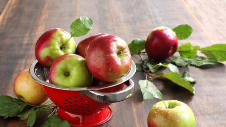 Vibrant Apples in a Rustic Bowl wallpaper