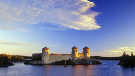 Majestic Island Castle Under Bright Sky wallpaper