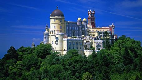 Majestic Castle Under a Clear Blue Sky wallpaper