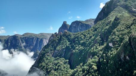 Majestic Mountain Peaks Under Clear Blue Sky wallpaper