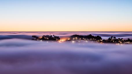 Twilight City Beneath a Misty Sky wallpaper