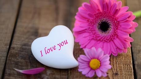 Love Heart with Flowers on Wooden Background wallpaper