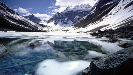 Majestic Mountains Reflected in Crystal Clear Waters wallpaper