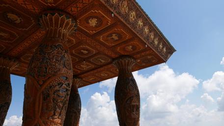 Majestic Carvings Under a Vibrant Sky wallpaper