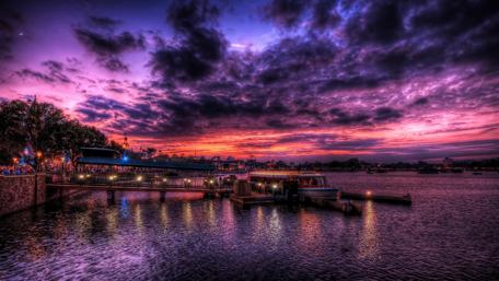 Dramatic Purple Sky Over Serene Harbor Evening wallpaper