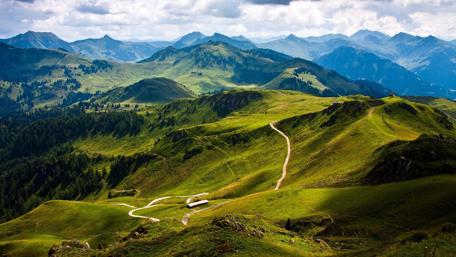 Majestic Mountain Landscape with Lush Meadows wallpaper
