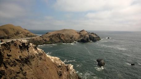 Stunning Coastal View of Rocky Shores and Ocean Waves wallpaper