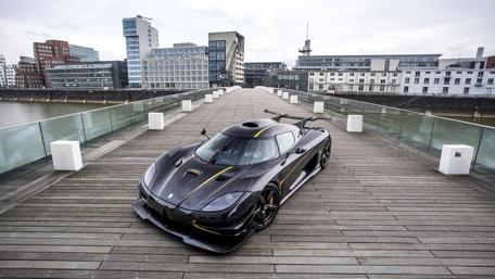 Sleek Dream Car on a City Bridge wallpaper