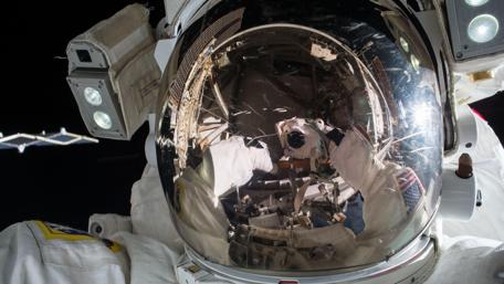 Astronaut Reflection in Space Helmet Wallpaper wallpaper