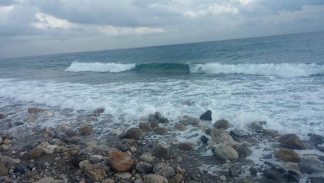 Serene Coastal Waves and Rocky Shoreline wallpaper