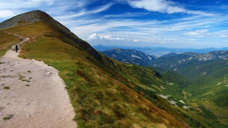Majestic Mountain Views Amidst a Vast Sky wallpaper