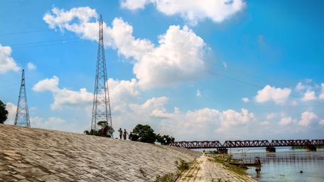 Serene River View Under Blue Sky wallpaper