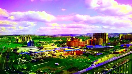 Vibrant Cityscape Under a Colorful Sky wallpaper