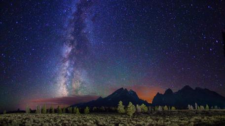 Milky Way Over Serene Landscape wallpaper