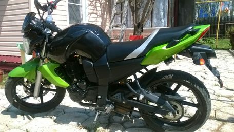 Sleek Black and Green Motorcycle Design wallpaper