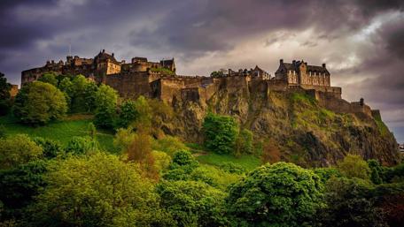 Majestic Scottish Castle under Dramatic Skies wallpaper