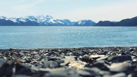 Tranquil Seashore and Majestic Mountains wallpaper