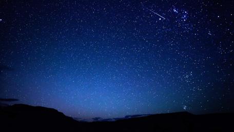 Starry Night Sky Over Quiet Landscape wallpaper