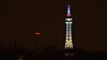 Illuminated Tower Against a Night Sky wallpaper
