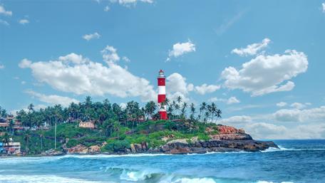 Lighthouse by the Seaside on a Sunny Day wallpaper