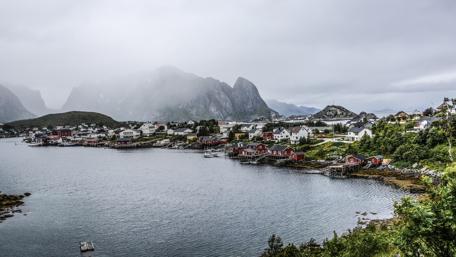Scenic Lofoten Village Amidst Clouds and Fjords wallpaper
