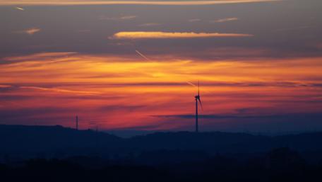 Serene Windmill at Sunset Glow wallpaper