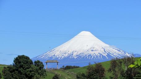 Majestic Volcano Under Clear Skies in 4K wallpaper