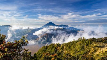 Majestic Mount Bromo Surrounded by Clouds in Indonesia wallpaper