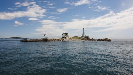 Serene Lighthouse on Harbor Island Bay Scene wallpaper
