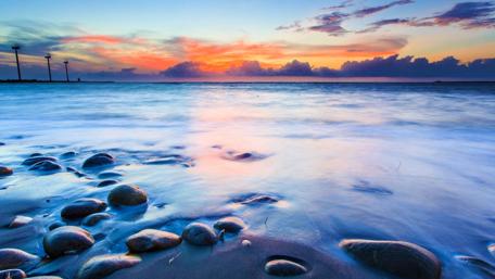 Tranquil Sunset Over Serene Shoreline wallpaper