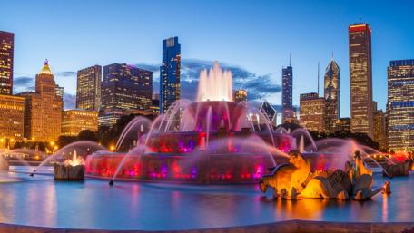 Skyscrapers and Fountain in City Evening wallpaper