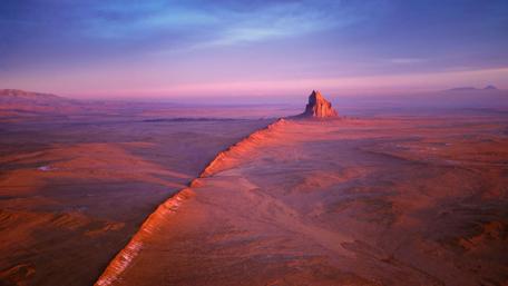 Majestic Rock Formation in Desert Sunset Light wallpaper