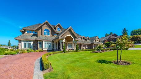 Stunning Mansion Surrounded by Lush Greenery wallpaper